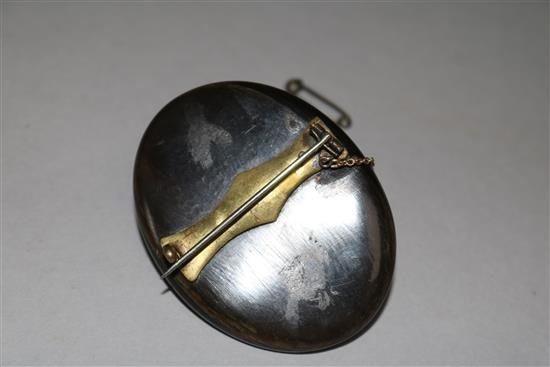 A horn mounted carved ivory cameo brooch, 2in.